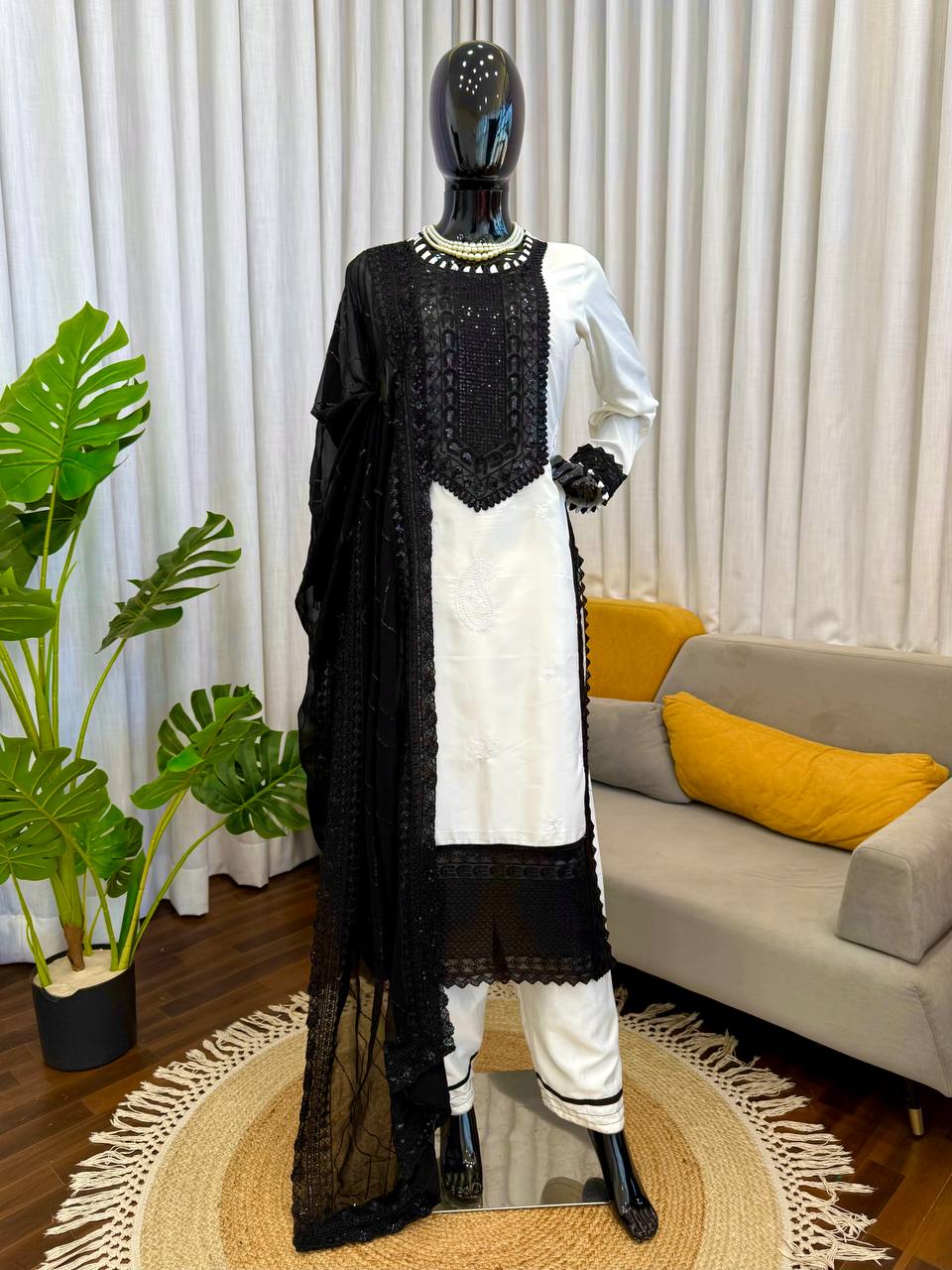 Ivory and Black Embroidered Salwar Kameez Set with Lace Detailing